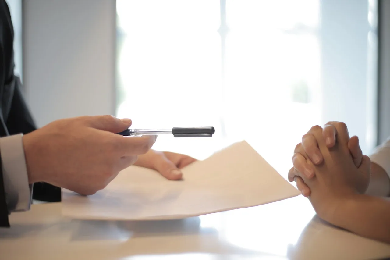 an picture of a document being signed